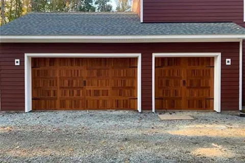 a red barn with a garage door