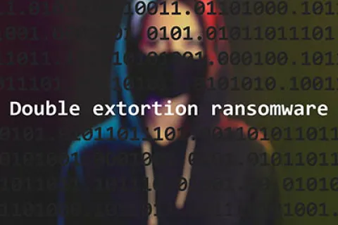 Hacker in a hoodie and mask with digital binary code and text double extortion ransomware overlay.