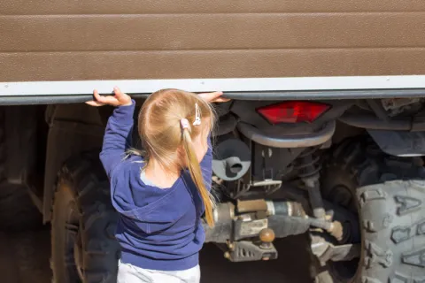 a person looking at a car