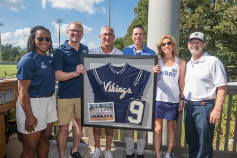 a group of people holding a sign