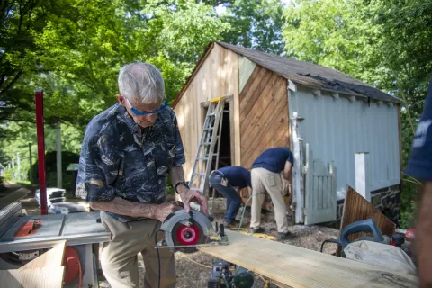 a group of people working outside