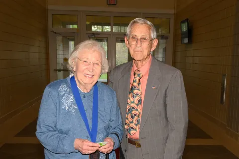 Berry Alumni couple pose in hallway
