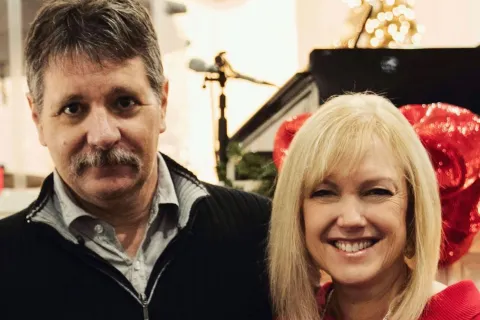 Berry alumna Susan Powell and her husband smile for a close-up photo