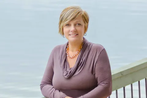 Berry alumna standing by ocean