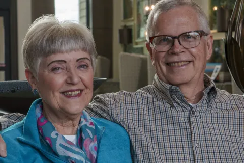 a man and woman smiling