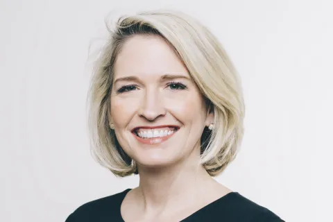 a woman smiling for the camera