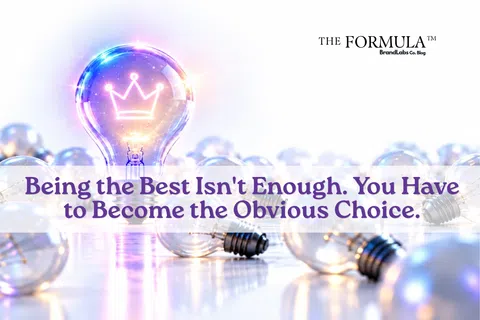 Glowing light bulb with crown icon among unlit bulbs with motivational text about becoming the obvious choice.