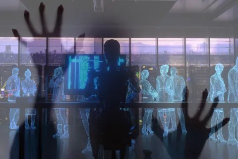 Robot analyzing digital holograms of people in a futuristic office with computer code on screens at sunset.