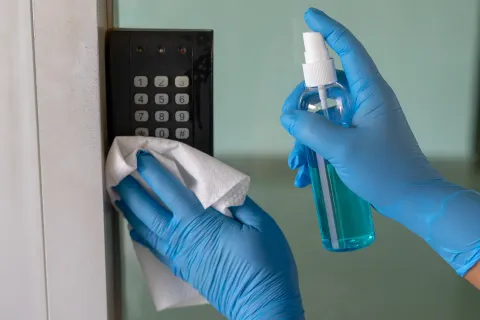 a person wearing gloves and a mask