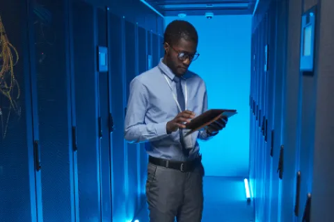 a man holding a tablet