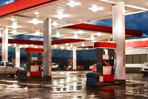 a gas station with cars parked