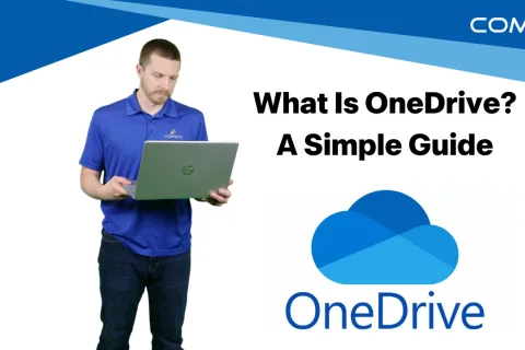 Man in blue shirt using laptop with OneDrive logo and text 'What Is OneDrive? A Simple Guide' on white background.