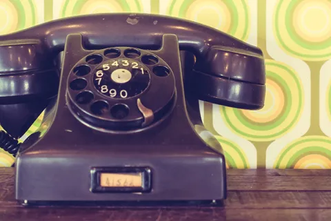 a black and gold telephone