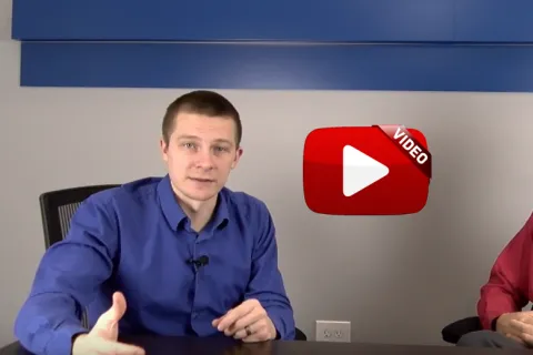 two men sitting in chairs