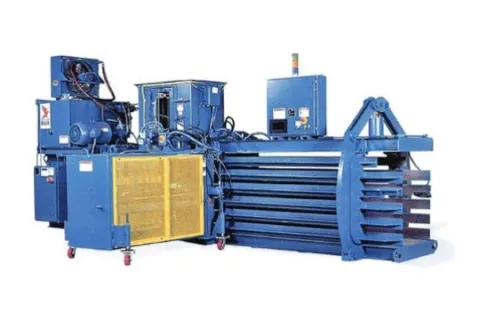 Industrial blue baler machine with yellow safety guard and control panel for compacting materials.
