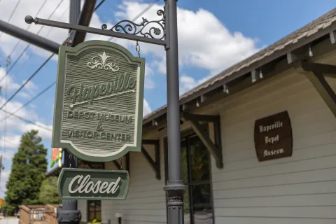 a sign hangs from a pole