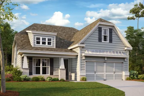 a small house with a grey exterior and front yard