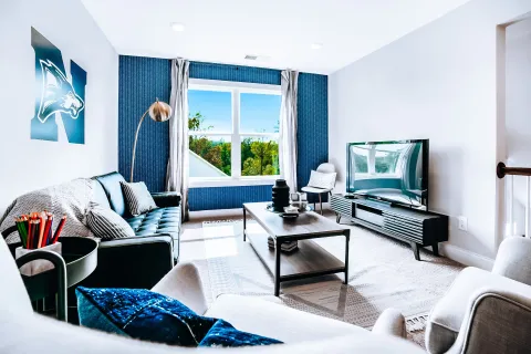 a living room with a tv and couches