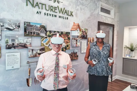 a couple of men wearing hard hats and holding cups