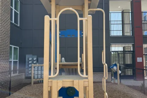 a play structure outside a building