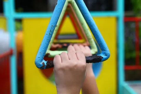 a hand holding a toy