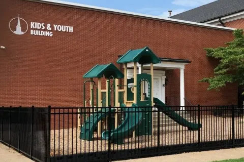 a building with a black fence