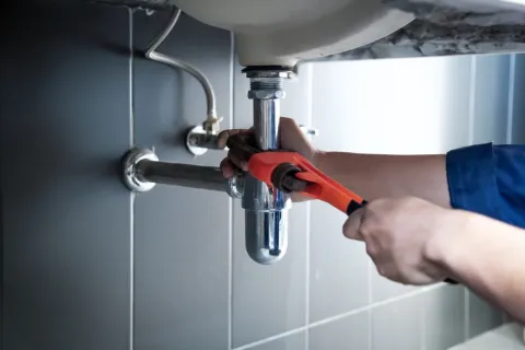 a person using a faucet