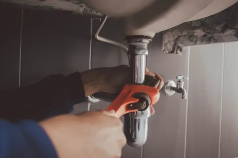 a person using a faucet