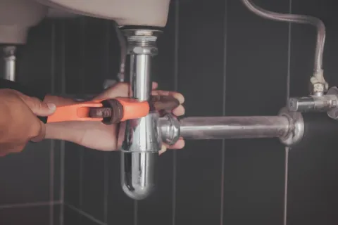 a person holding a drill