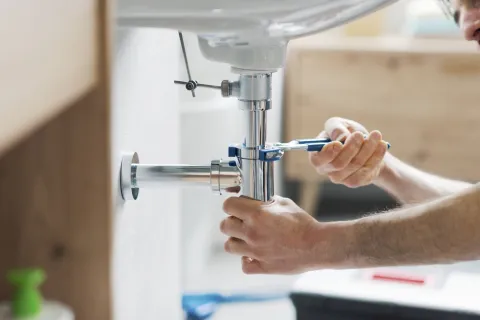 a person using a microscope