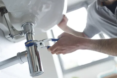 a man using a faucet