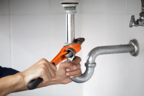 a person using a faucet