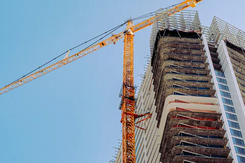 a crane lifting a building
