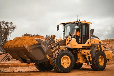 a tractor carrying a load