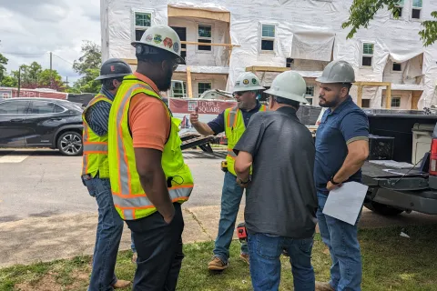 Essayon team and some trade partners at Temple Square Townhomes