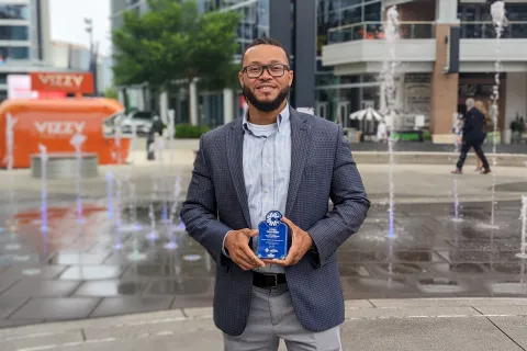 CEO & Founder, Israel Brown holding an award