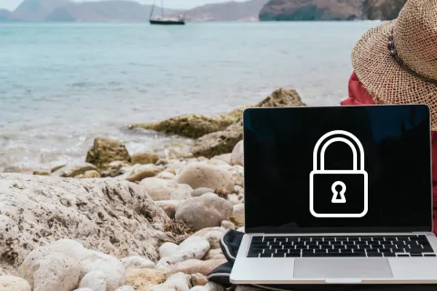 a laptop on a rocky beach