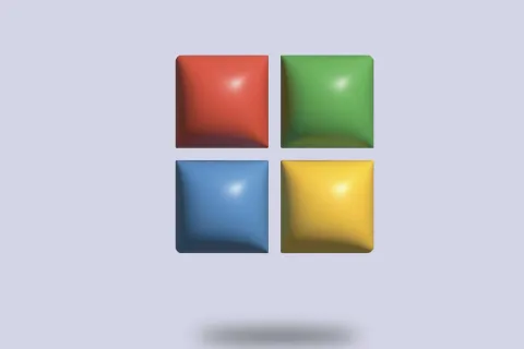 3D blocks in red, green, blue, and yellow arranged in a square pattern with shadow on light background