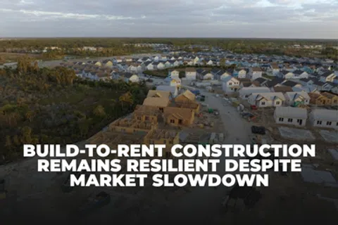 Aerial view of a housing development under construction highlighting build-to-rent resilience during market slowdown.