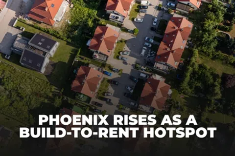 Aerial view of a residential neighborhood with red-roofed houses and parked cars emphasizing Phoenix's rental market growth.