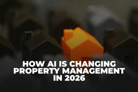 Orange model house among black houses with text how AI is changing property management in 2026.