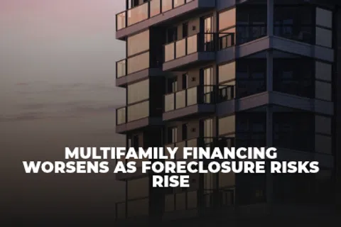 A modern multifamily apartment building at dusk with overlaid text reading multifamily financing worsens as foreclosure risks rise
