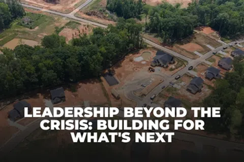 Aerial view of a suburban neighborhood under construction with text about leadership and building the future.