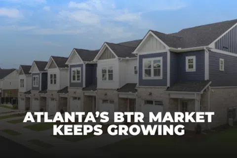 Row of modern townhouses under blue sky with text about Atlanta's growing build-to-rent market.