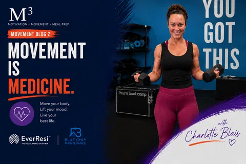 Woman holding dumbbells smiling in gym with motivational text 'Movement is Medicine' and 'You Got This' on walls.