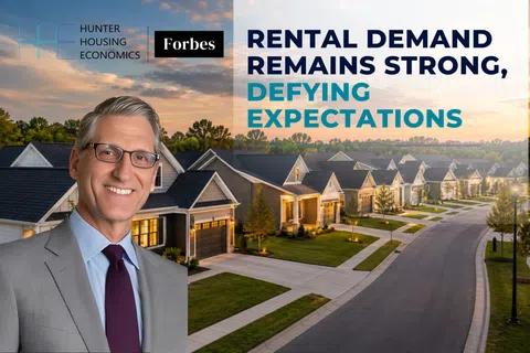 Smiling man in suit with suburban neighborhood background and text about strong rental demand defying expectations.