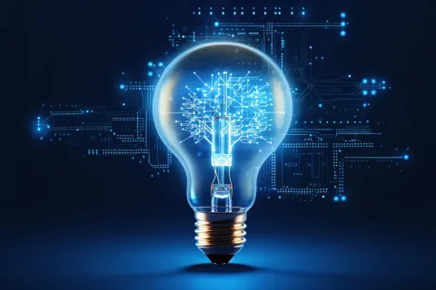 Glowing light bulb with digital circuit tree inside symbolizing innovation and technology advancement ideas.