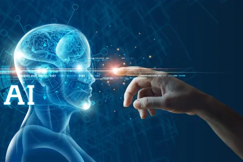 Human hand reaching out to touch glowing digital AI brain inside transparent human head with futuristic background.