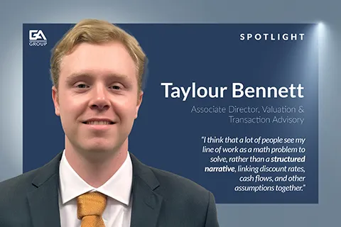 Professional portrait of Taylour Bennett with a spotlight background and a white text quote on valuation advisory work.