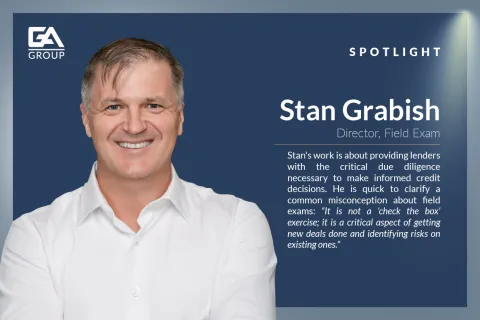 Smiling man Stan Grabish in white shirt featured in GA Group spotlight with role and work description
